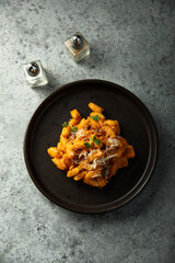 Pasta with red pesto and cheese