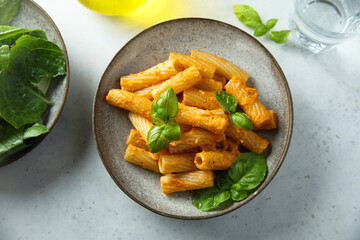 Pasta with red pesto and cheese