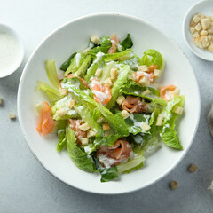 Traditional homemade Caesar salad with smoked salmon
