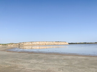 Transparent salt lake water, blue sky