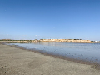 Transparent salt lake water, blue sky