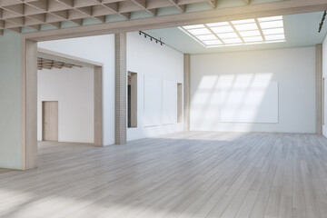 Luxury concrete exhibition hall interior with wooden flooring, empty posters and sunlight. Gallery concept. 3D Rendering.