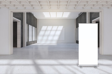Modern concrete exhibition hall interior with empty white mock up poster stand and sunlight. Gallery concept. 3D Rendering.