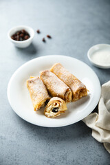 Homemade crepes with ricotta and raisins