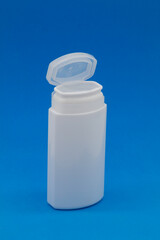 white plastic box in front of blue background