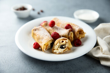 Homemade crepes with ricotta and raisins