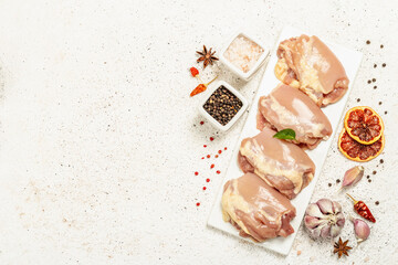Raw chicken thigh without bones or skin. A useful ingredient for preparing healthy food, spices