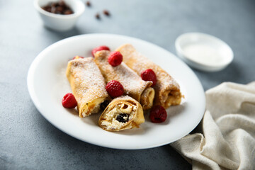 Homemade crepes with ricotta and raisins