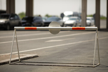 Road barrier for cars at a land border checkpoint zone between Romania and Bulgaria.
