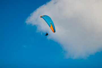 paragliding in the blue sky
