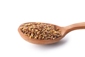 Spoon of buckwheat tea isolated on white background