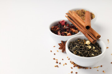 Concept of cooking tea with different types of tea on white background