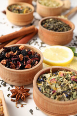 Concept of cooking tea with different types of tea on white background