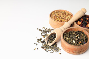 Concept of cooking tea with different types of tea on white background