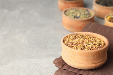 Concept of cooking tea with different types of tea on light textured background