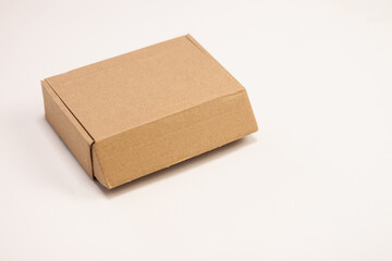 Small cardboard box for storing things on a white background.