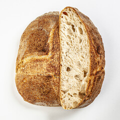 Hand made fresh bread cut in halfs isolated on white background