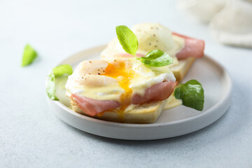 Traditional homemade Benedict eggs with ham