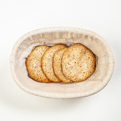 Hand made butter cookies in basket isolated on white background