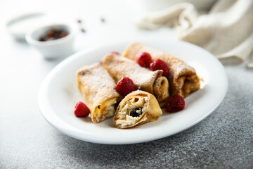 Homemade crepes with ricotta and raisins