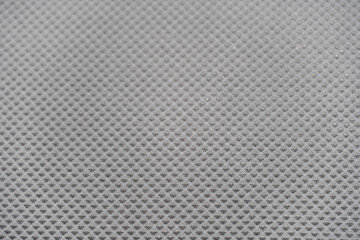 Black blank background for design or text insertion, corrugated rubber surface.