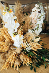 Wedding decor for newlyweds at a banquet. Dried flowers floristry with boho style