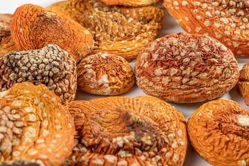 Dried red Amanita muscaria or fly agaric mushrooms. Micro dosing and alternative herbal medicine.