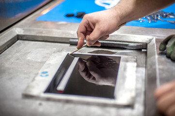 Worker technician work with soft PVC liquid rubber in mold