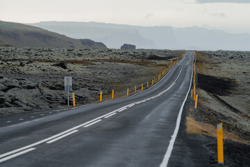 Wet Isolated straight road after the storm in Iceland