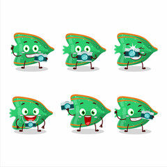 Obraz premium Photographer profession emoticon with fish green gummy candy cartoon character