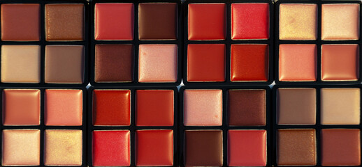 Big palette with shades of lip gloss. Background. Nobody. New cosmetics. Collection of four shades.