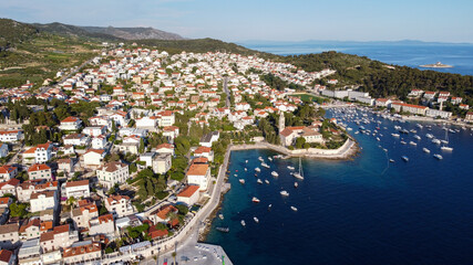 Streets of historic and tourist town of Hvar with fort, port and yacht marine, Croatian island otok...