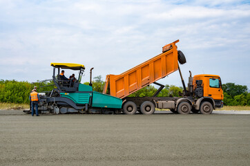 Obraz premium Road construction, asphalt concrete paving