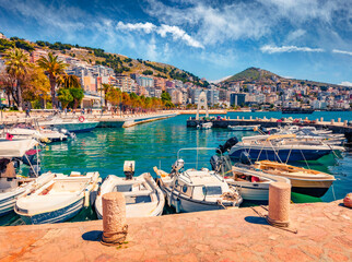 Wonderful spring cityscape of Saranda port. Beautiful Ioninian seascape. Colorful morning scene of...