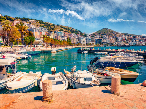 Wonderful spring cityscape of Saranda port. Beautiful Ioninian seascape. Colorful morning scene of Albania, Europe. Traveling concept background.