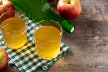 Apple cider drink on wooden table.Copy space