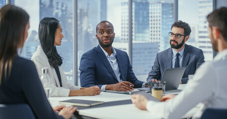Modern Multi-Ethnic Office Conference Room Meeting: Ambitious Motivated Black Businessman...
