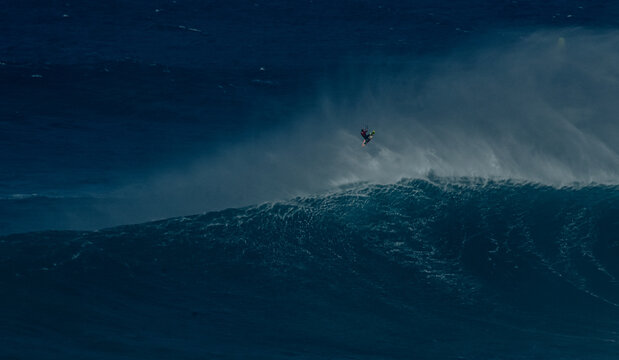 Sport photography. Jaws swell on International surfing event in Maui, Hawai 2021 December.