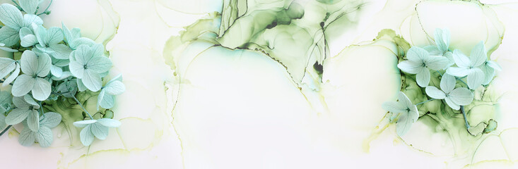 Creative image of pastel mint green Hydrangea flowers on artistic ink background. Top view with copy space