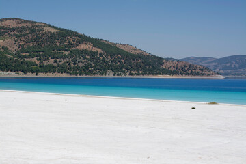 Fototapeta na wymiar Salda Lake with its special white sand and turquoise blue in Burdur, Turkey.