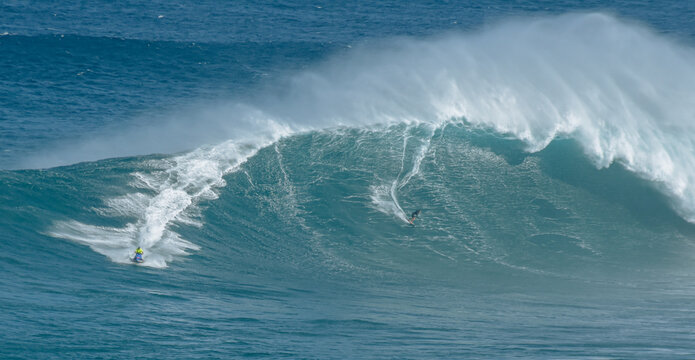 Sport photography. Jaws swell on International surfing event in Maui, Hawai 2021 December.