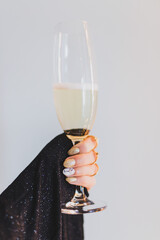 Woman holding a glass of champagne
