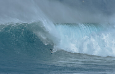 Sport photography. Jaws swell on International surfing event in Maui, Hawai 2021 December.