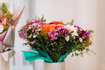 Decoration of the wedding hall with flowers in pink and white shades