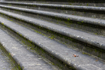 Slanted side view on old vintage sandstone steps with focus on foreground
