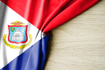 Sint Maarten flag. Fabric pattern flag of Sint Maarten. 3d illustration. with back space for text.