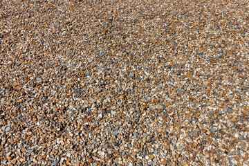 Gravel background of rock pebble stones used for landscaping and pathways in gardens with a nice texture pattern, stock photo image