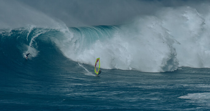 Sport photography. Jaws swell on International surfing event in Maui, Hawai 2021 December.