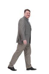 full-length. casual man in a grey jacket striding forward.