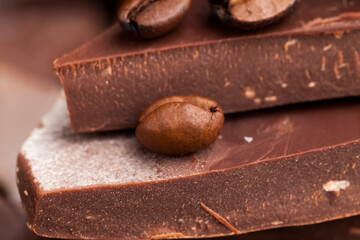 coffee and pieces of milk chocolate from cocoa